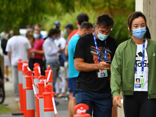 Tennis player Wang Qiang (right) of China waits for a coronavirus test in Melbourne.