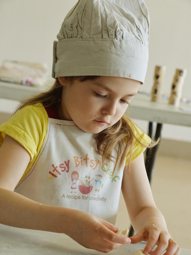 Kids in Port Melbourne cooking up a storm as part of a new school holiday program by a Melbourne business called Itsy Bitsy Chef which is promoting healthy eating in kids. They teach the kids to cook all types of foods from Moroccan to Italian. Picture: Kris Reichl