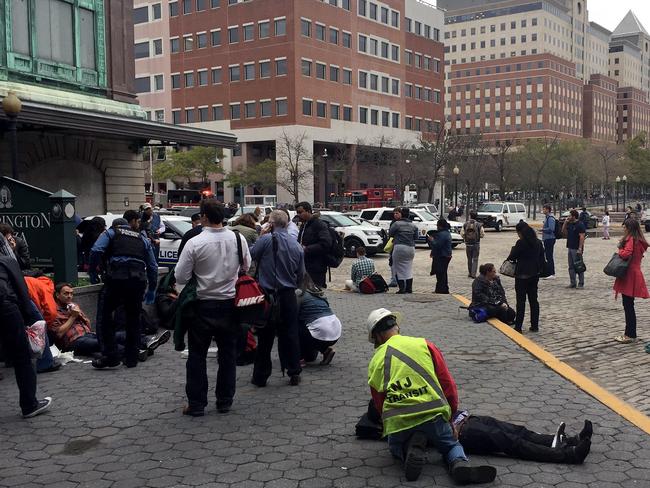 People are treated for their injuries outside after a NJ Transit train crashed into the platform. Picture: Pancho Bernasconi/Getty Images/AFP