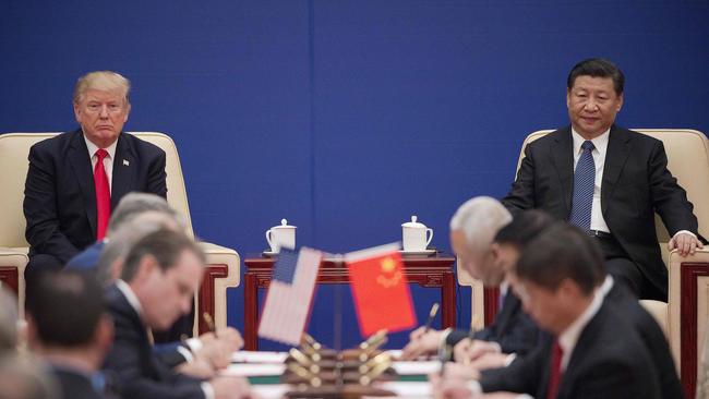 Trump and China's President Xi Jinping attending a business leaders event inside the Great Hall of the People in Beijing in 2017. Picture: Nicolas Asfouri/AFP