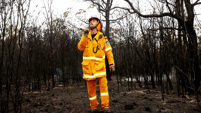 Thornton RFS fire fighter Simon Rumble welcomes the rain to the Neath fireground. Picture by Peter Lorimer