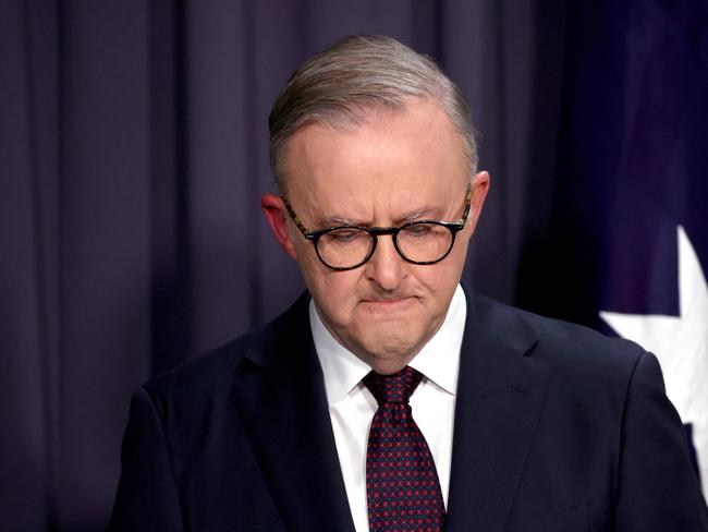 TOPSHOT - Australia's Prime Minister Anthony Albanese reacts as he speaks during a media conference at Parliament House in Canberra on October 14, 2023. Australians have roundly rejected greater rights for Indigenous citizens, scuppering plans to amend the country's 122-year-old constitution after a divisive and racially-tinged referendum campaign. (Photo by DAVID GRAY / AFP)