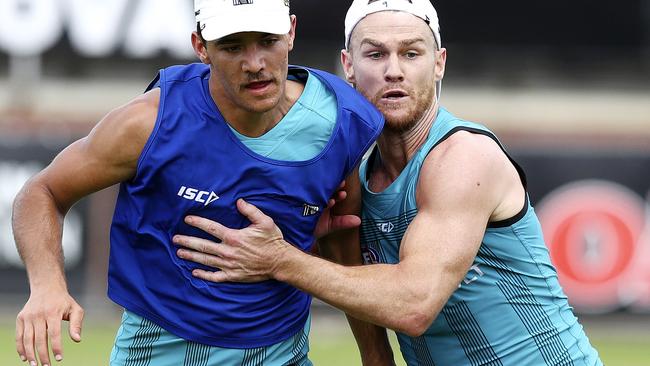 Promising ... Riley Bonner battles with Robbie Gray at Port Adelaide training. Picture: Sarah Reed.