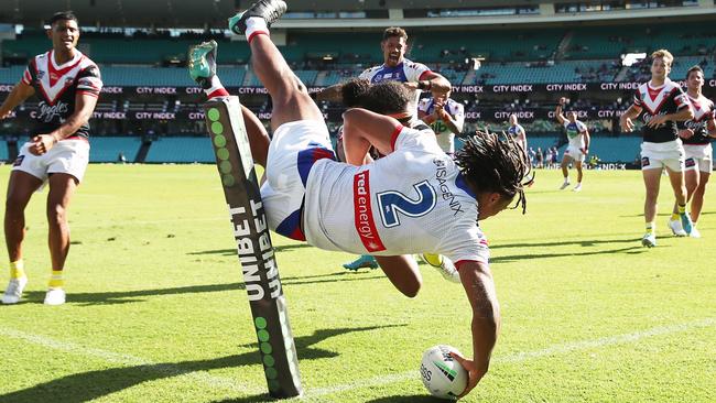 Dominic Young leaps over the Roosters defence to score a great try.