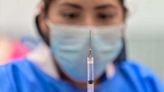 A nurse prepares a dose of the Pfizer Covid vaccine for children. Picture: Pedro Pardo/AFP