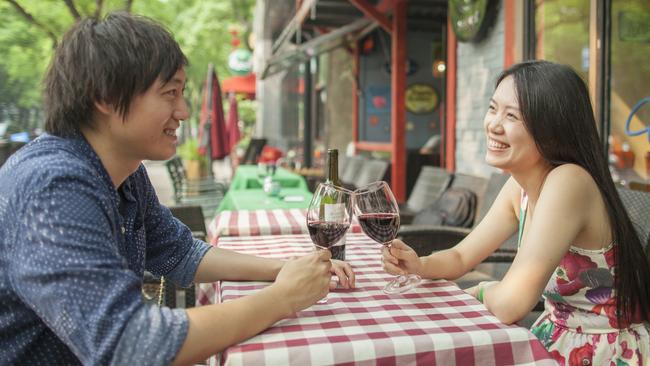 A young Chinese couple drink Penfolds wine in Beijing. Pic: Shannon Fagan