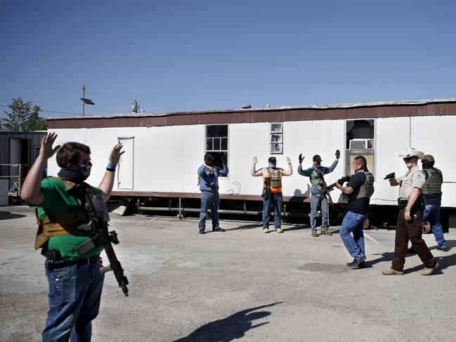 The Ector County Sheriff's Office confronted the armed men.