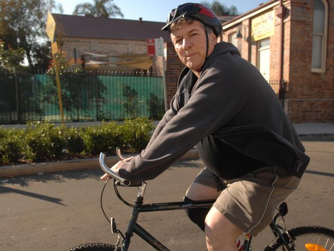 Then NSW Education Minister John Della Bosca leaves his mother's home in Leichhardt, Sydney on push bike heading towards the CBD, after losing his driver's licence.