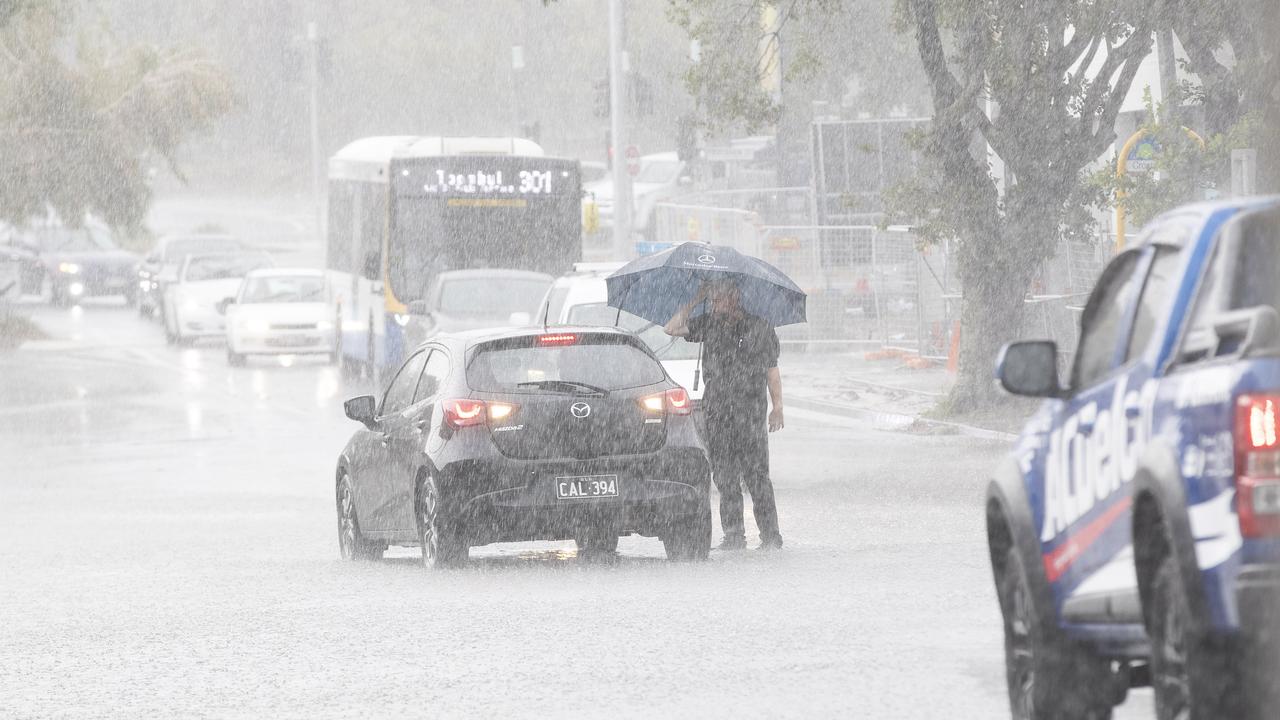 Streets are flooding around Brisbane as storm hits the city on Friday afternoon. Crosby Rd, Hamilton, Brisbane, 13th of December 2019. (AAP Image/Attila Csaszar)