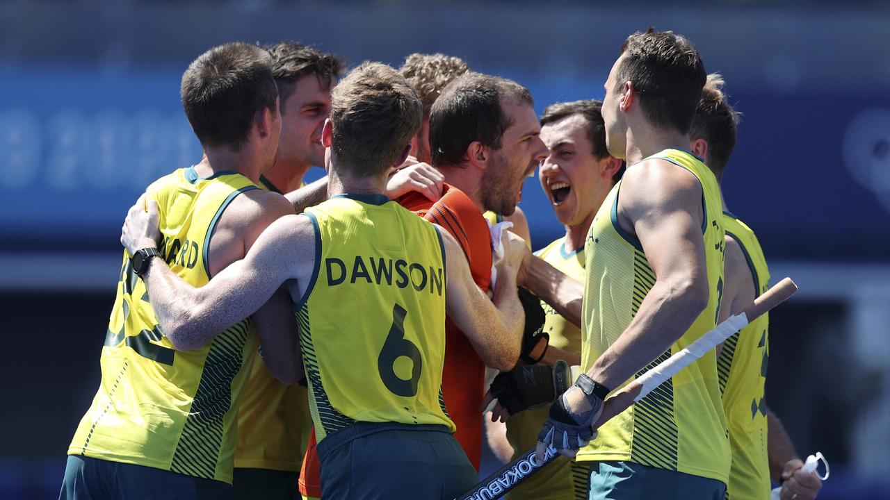 TOKYO, JAPAN - AUGUST 01: Andrew Lewis Charter and Matthew Dawson of Team Australia and teammates celebrate after winning the penalty shootout after the Men's Quarterfinal match between Australia and Netherlands on day nine of the Tokyo 2020 Olympic Games at Oi Hockey Stadium on August 01, 2021 in Tokyo, Japan. (Photo by Naomi Baker/Getty Images)