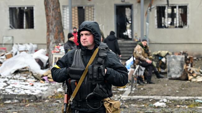 An armed man stands on a checkpoint in the city of Brovary outside Kyiv. Picture: Genya Savilov