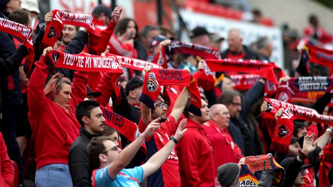 The club’s loyal Red Army supporter group were among a below-par Hindmarsh Stadium crowd for the Wellington Phoenix encounter. Picture: AAP Image/Kelly Barnes