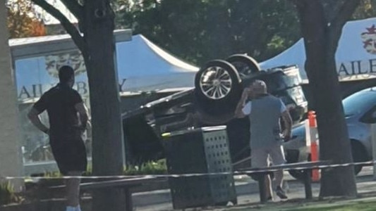 Overturned car outside Haileybury Grammar PICTURE: Supplied