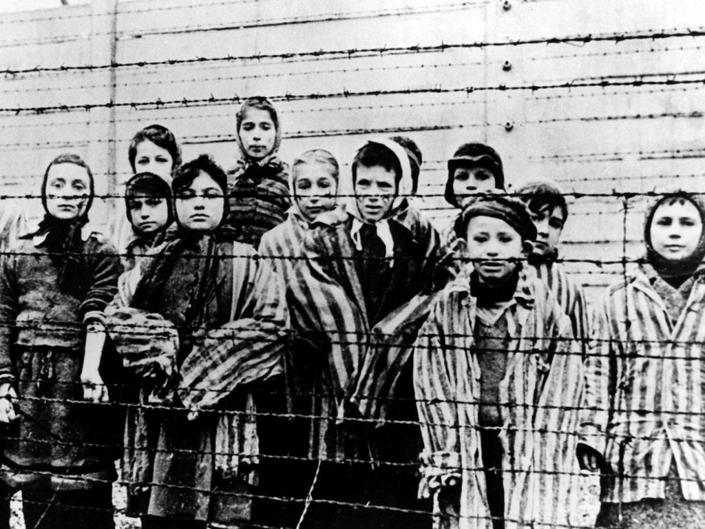 This file picture, taken just after the liberation of Auschwitz in January, 1945, shows a group of children wearing concentration camp uniforms. Picture: AP Photo