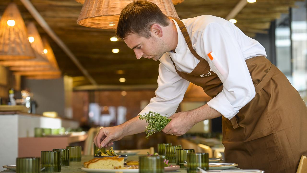 Callum Hann adds the final touches to a dish. Picture: Roy VanDerVegt