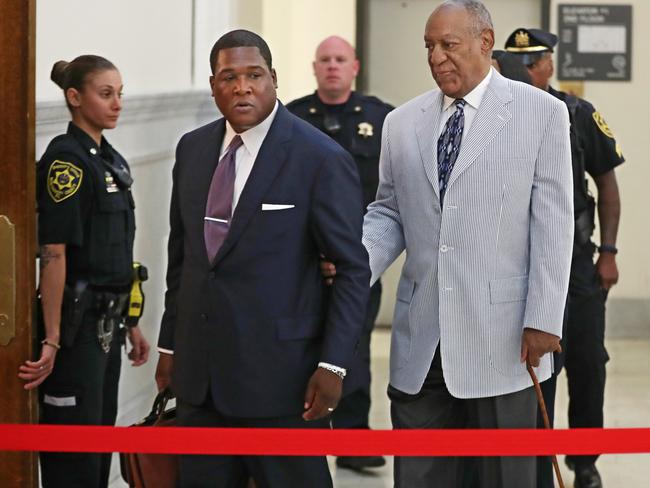 Bill Cosby is led into Courtroom A in the Montgomery County Courthouse in Norristown, Pennslyvania by one of his aides. Picture: Michael Bryant/The Philadelphia Inquirer via AP, Pool