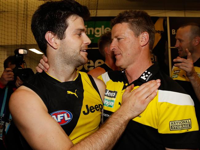 Trent Cotchin of the Tigers celebrates with Damien Hardwick