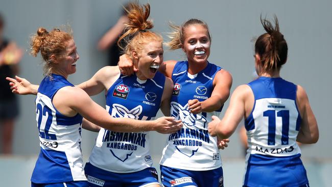 Tassie Roos Georgia Nanscawen, left, Alison Drennan, Kaitlyn Ashmore and Daisy Bateman of the Kangaroos celebrate during the AFLW Round 1 match at North Hobart Oval. Picture: ADAM TRAFFORD/AFL MEDIA/GETTY IMAGES