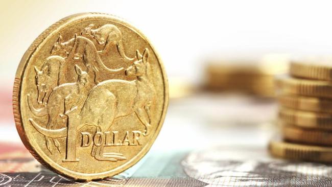 Aussie one dollar coins, on a twenty dollar note.