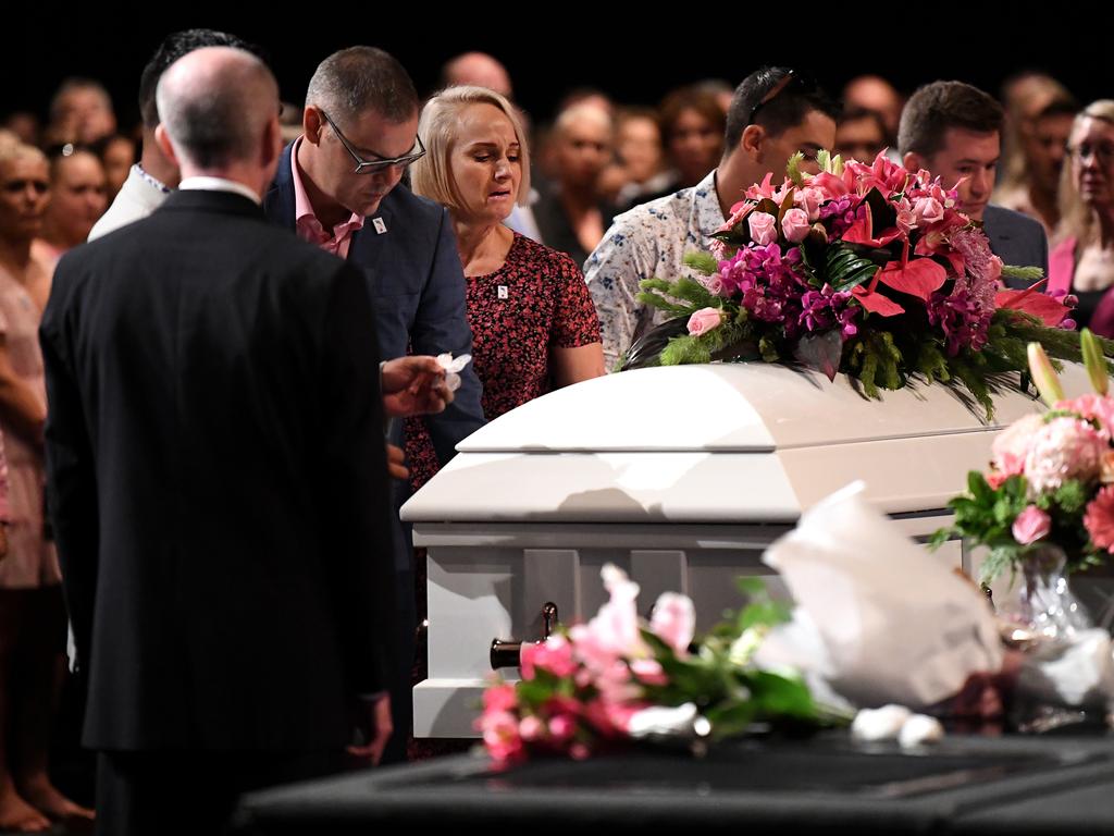 Mourners are seen next to the coffin during the funeral for Hannah Clarke and her three children Aaliyah, Laianah and Trey in Brisbane. Picture: Dan Peled/AAP