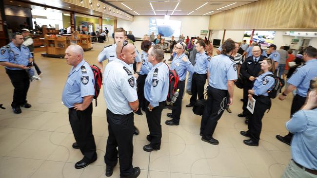 Some of the Tasmanian Fire Service personnel on their arrival back in Hobart. Picture: RICHARD JUPE