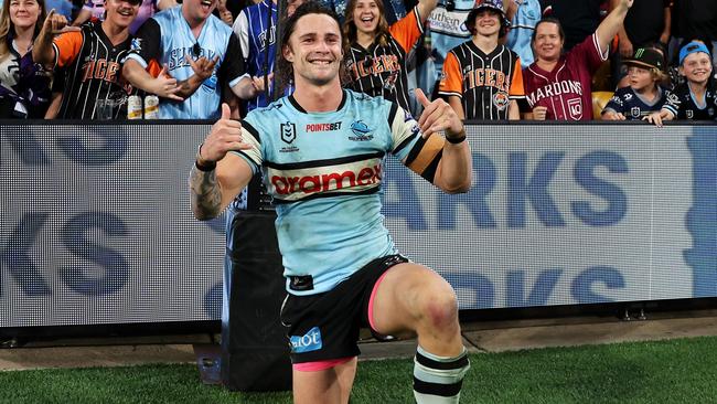 BRISBANE, AUSTRALIA - MAY 18: Nicho Hynes of the Sharks poses with the crowd as he celebrates victory during the round 11 NRL match between Cronulla Sharks and Sydney Roosters at Suncorp Stadium, on May 18, 2024, in Brisbane, Australia. (Photo by Hannah Peters/Getty Images)