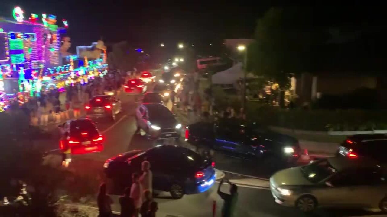 Large crowd and traffic at Merry Strickland Christmas lights display