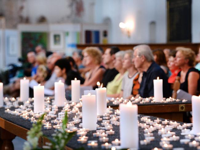 People attend a service in memory of the 298 victims of the downed Malaysia Airlines flight MH17 on July 23, 2014 at the Joriskerk church in Amersfoort.
