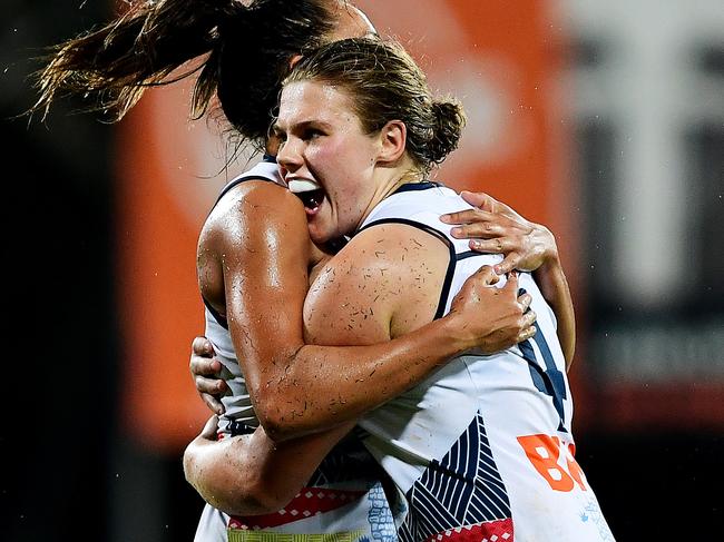 Adelaide Crows' Chloe Scheer celebrates with Adelaide Crows' Justine Mules after her goal during the third quarter of Saturday nights AFLW match against the Fremantle Dockers in Darwin, Northern Territory. Picture: Justin Kennedy