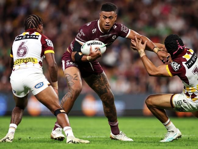 BRISBANE, AUSTRALIA - MAY 17: HaumoleÃÂ Olakau'atu of the Sea Eagles is tackled during the round 11 NRL match between Manly Sea Eagles and Brisbane Broncos at Suncorp Stadium, on May 17, 2024, in Brisbane, Australia. (Photo by Hannah Peters/Getty Images)