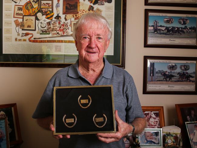 SYDNEY, AUSTRALIA -  MARCH 12 2023 - Former Legendary Jockey Kevin Langby poses for a portrait in his home on the North Coast of Sydney, with some of his Golden Slipper trophies ahead of the 2023 Golden Slipper Race at Rosehill in Sydney. Picture: Newscorp Daily Telegraph/ Gaye Gerard