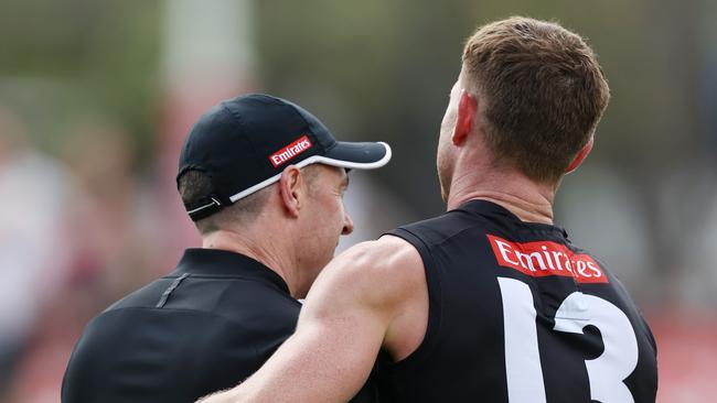 MELBOURNE, AUSTRALIA - September 20, 2023. AFL .   Craig Macrae, senior coach of the Magpies hugs Taylor Adams during Collingwood training session at Olympic Park, Melbourne.   Photo by Michael Klein.