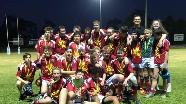 BIG GRINS: Scots PGC College and Warwick Water Rats’ U13s team with their grand final medals. Picture: Tess Enchelmaier