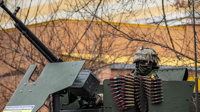 A Ukrainian soldier sits in an armored car in the suburbs of Kyiv. Picture: AFP