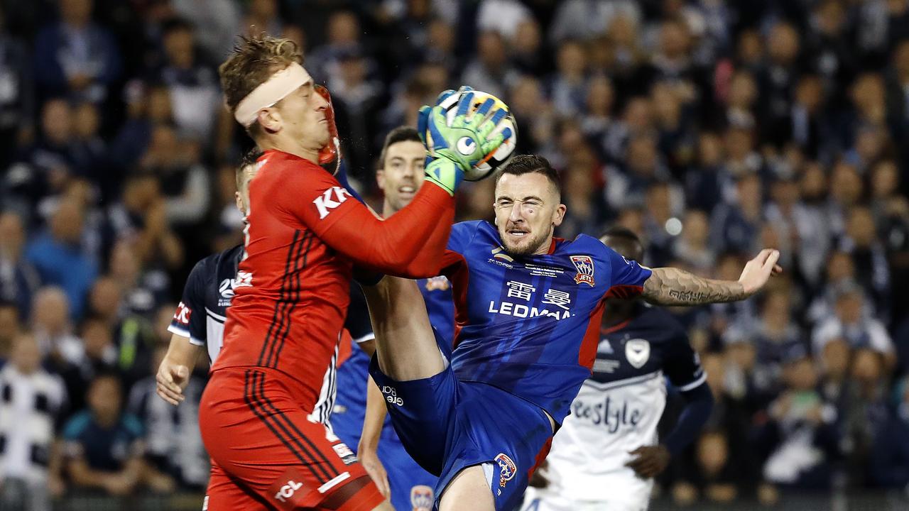 Newcastle Jets striker Roy O'Donovan catches Melbourne Victory's Lawrence Thomas with a high boot which sees him sent off during the 2018 A-League Grand Final.