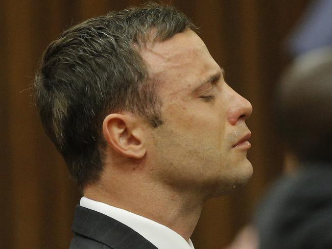 Oscar Pistorius reacts in the dock as Judge Thokozile Masipa delivers her verdict. AP Photo/Kim Ludbrook