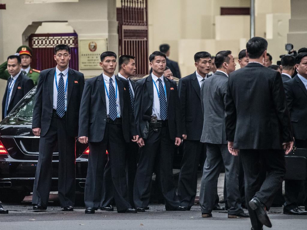 The North Korean leader’s armoured limo was barely visible among the swarm of bodyguards at the North Korean embassy in the Vietnamese capital. Picture: Carl Court/Getty Images