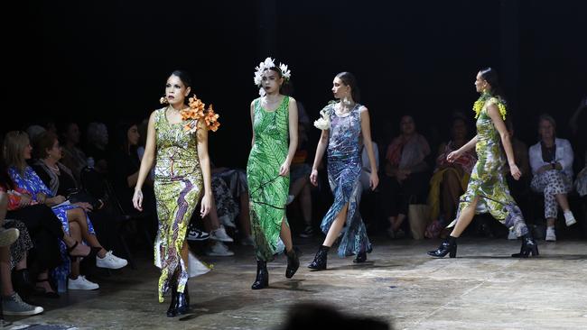 Lynette Gee Gee leads a posse of models showcasing the Green Love collection from designer Bernard Singleton at the Cairns Indigenous Art Fair fashion performance, Woven, held at the Tanks Arts Centre, Edge Hill. Picture: Brendan Radke