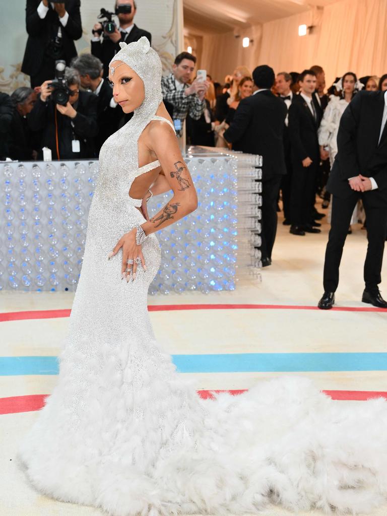 The glittering dress was complete with a fluffy tail and cat ears. Picture: Angela Weiss/AFP.