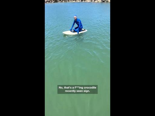 Disbelief as man paddles in crocodile infested waters despite surrounding warning signs