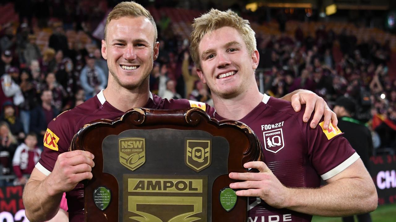 Daly Cherry-Evans and Tom Dearden celebrate Queensland’s success.