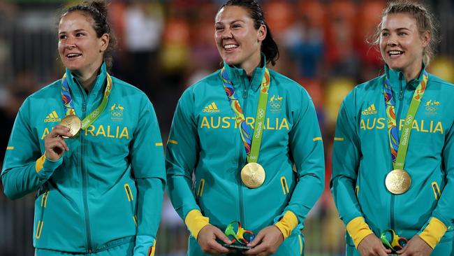 Shannon Parry, Sharni Williams and Nicole Beck celebrate winning the 2016 Rio Olympic Women's Rugby Sevens gold medal