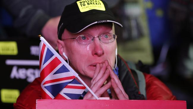 An anti-Brexit demonstrator cries as he gathers in parliament square in London. Picture: AP 