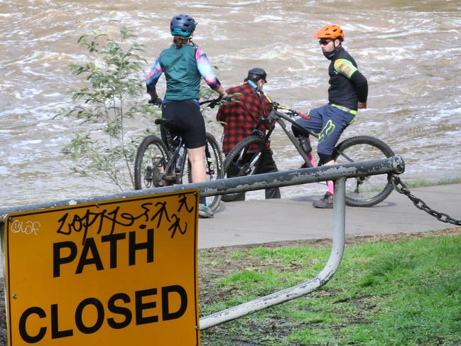 MELBOURNE, AUSTRALIA- NewsWire Photos AUGUST 24, 2020:People watch a fast running Yarra River at Dight falls after a couple of days of heavy rain, during their COVID-19 stage four lockdown in Melbourne. Picture: NCA NewsWire/ David Crosling