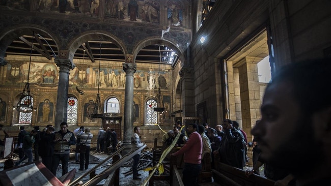 Egyptian security forces inspect the scene of a bomb explosion at the St Peter and St Paul Coptic Orthodox Church in December 2016. Picture: AFP