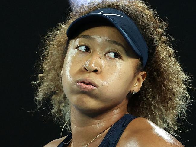 (FILES) This file photo taken on February 20, 2021 shows Japan's tennis player Naomi Osaka reacting on a point against Jennifer Brady of the US during their women's singles final match on day thirteen of the Australian Open tennis tournament in Melbourne. - Naomi Osaka has pulled out of Berlin WTA grasscourt tournament in the wake of her controversial exit from the French Open, organisers confirmed on June 7, 2021. (Photo by David Gray / AFP) / -- IMAGE RESTRICTED TO EDITORIAL USE - STRICTLY NO COMMERCIAL USE --