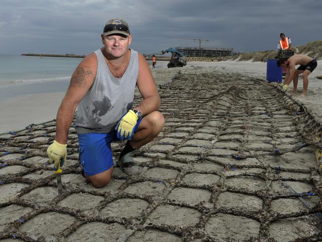 Eco-Barrier owner Craig Moss with the barrier at Coogee Beach which was removed after a two-year trial due to a lack of funding from the State Government.