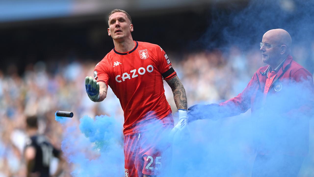 Aston Villa goalkeeper Robin Olsen reacts after a blue flare is thrown onto the pitch. Photo by Stu Forster/Getty Images