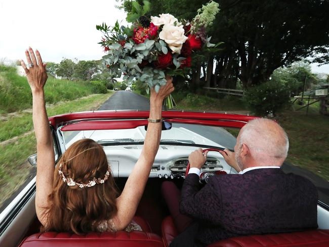 The happy couple head off for a new life together. Picture: Liam Kidston