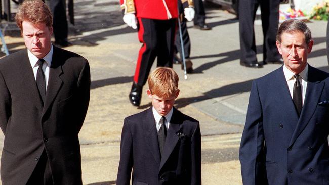 Earl Spencer, Diana's brother, with Prince Harry and Prince Charles at the funeral of Princess Diana in 1997. Picture: Gerry Penny / AFP